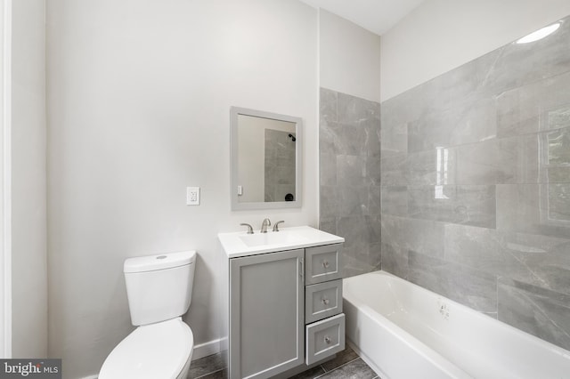 full bathroom with vanity, toilet, and tiled shower / bath combo