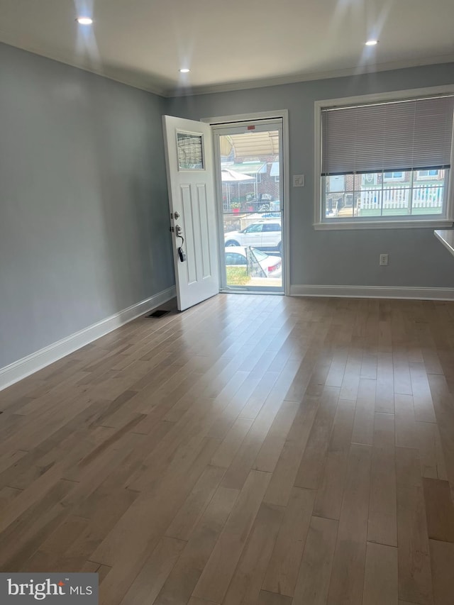 entryway with hardwood / wood-style floors