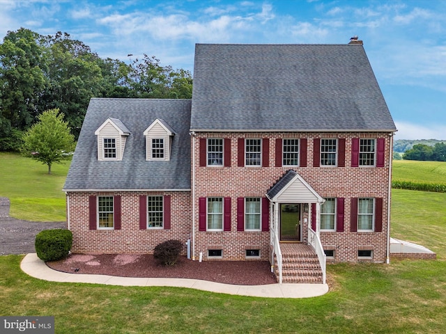 view of front of property with a front lawn