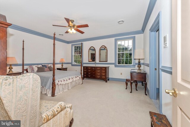 bedroom with ceiling fan, ornamental molding, and light carpet