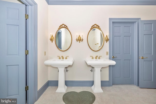 bathroom featuring tile patterned flooring and dual sinks