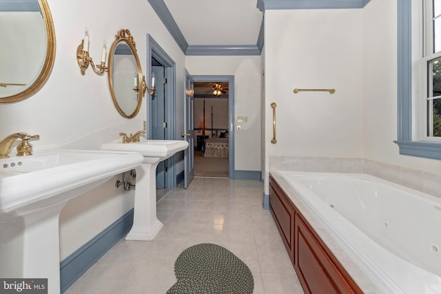 bathroom with tile patterned floors, ornamental molding, double sink, and a tub