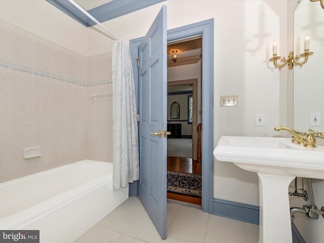 bathroom featuring tile patterned floors and shower / bathtub combination with curtain