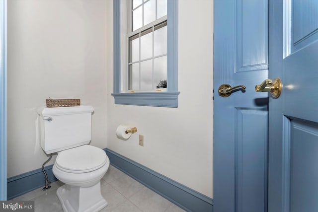 bathroom featuring tile patterned floors and toilet