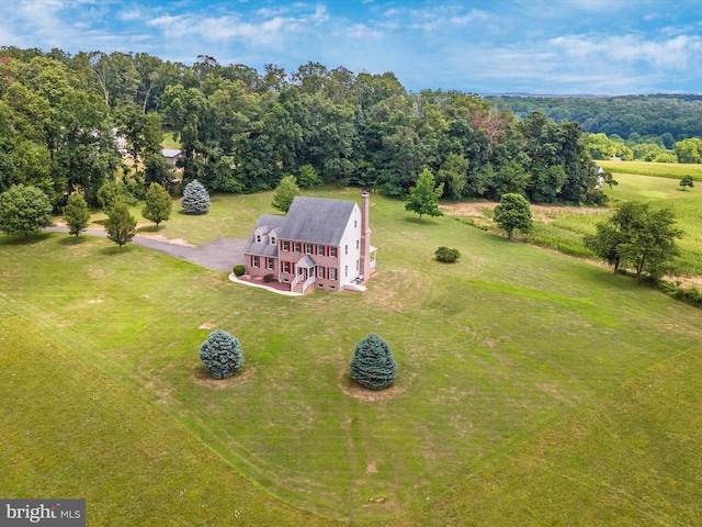 birds eye view of property with a rural view