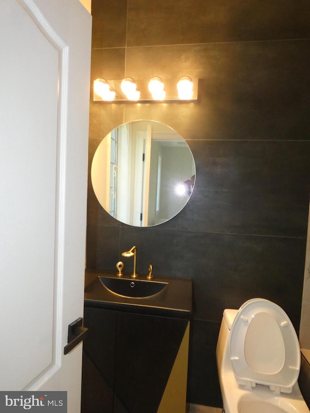 bathroom with vanity and toilet