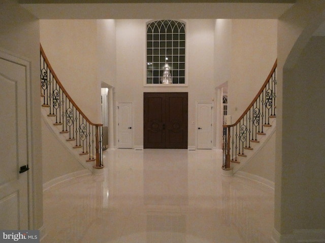 entryway featuring a high ceiling