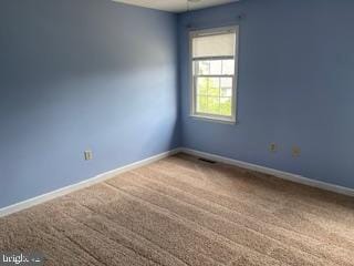 view of carpeted spare room