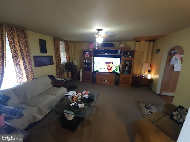 living room featuring carpet and ceiling fan