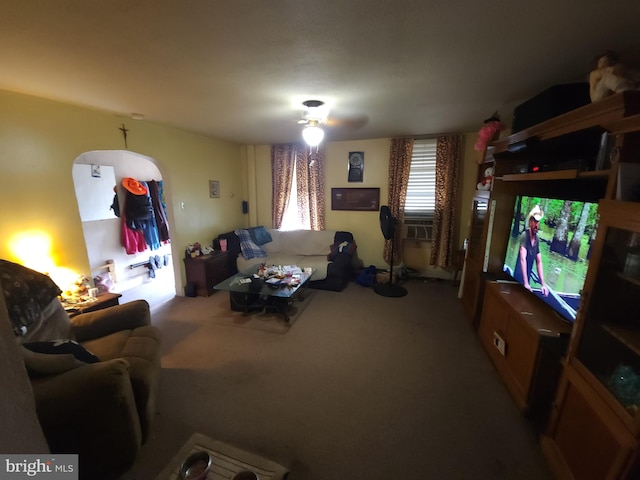 living room with ceiling fan and carpet flooring