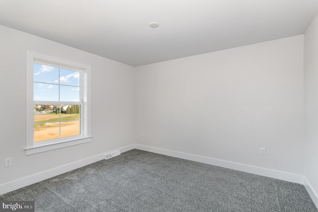 unfurnished room featuring carpet flooring