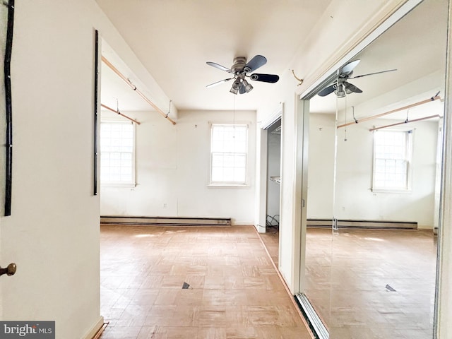 interior space featuring ceiling fan and a baseboard radiator