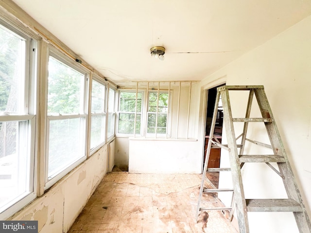 unfurnished sunroom with a healthy amount of sunlight