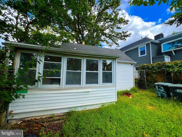 view of property exterior featuring a yard