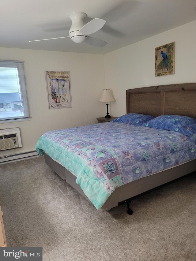 bedroom featuring a wall mounted air conditioner, carpet floors, and ceiling fan