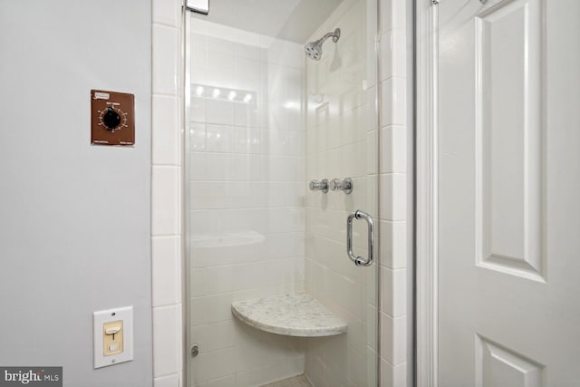 bathroom with a stall shower