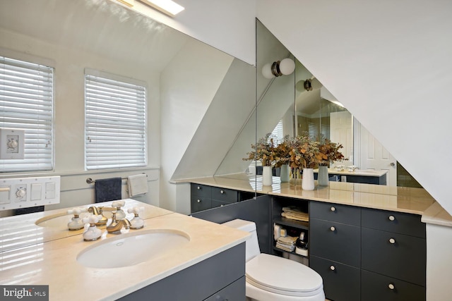 full bathroom with vanity and toilet