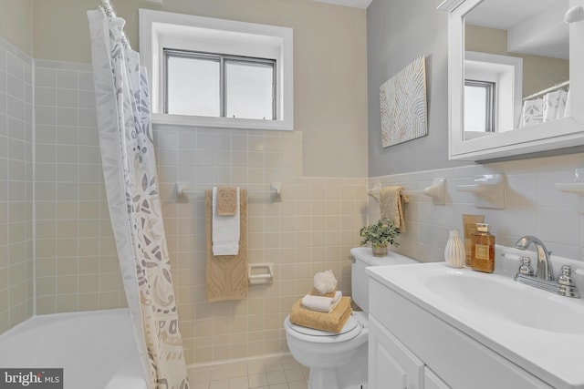 full bathroom featuring tile walls, vanity, shower / tub combo, toilet, and tile patterned floors