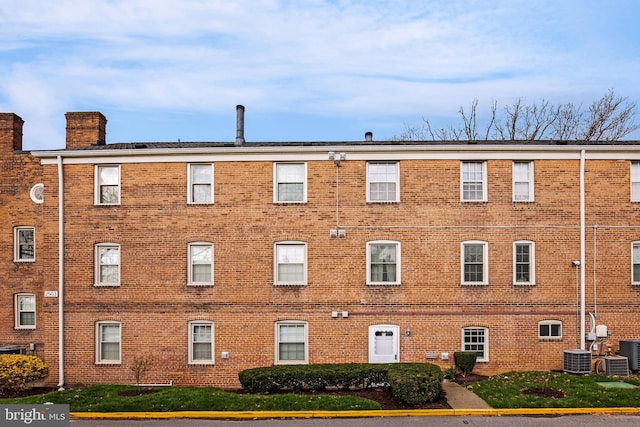 view of building exterior with cooling unit