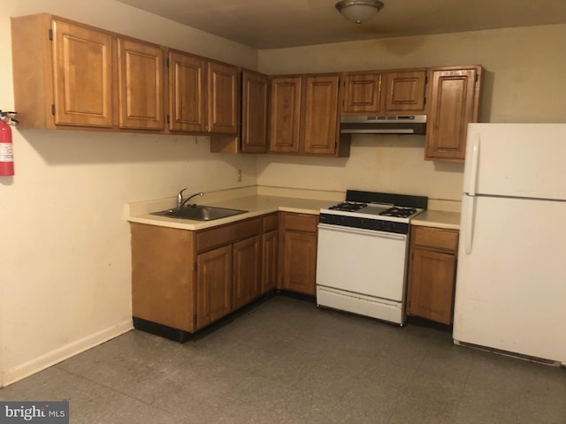 kitchen with sink and white appliances