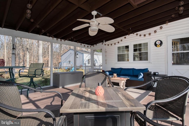 view of patio / terrace with ceiling fan, outdoor lounge area, and a deck