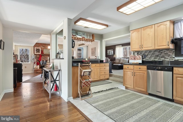 kitchen with wood-type flooring, light brown cabinetry, and dishwasher