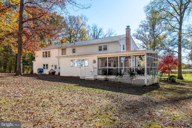 rear view of house with a sunroom