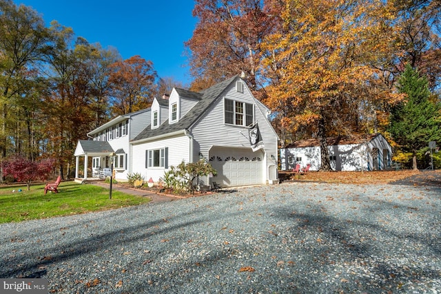 view of front of property featuring a garage and a front yard