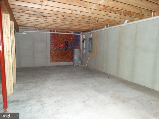 below grade area with electric panel and water heater