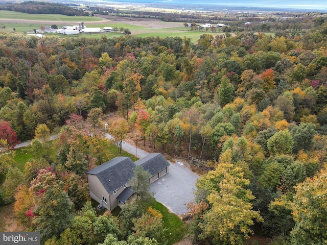 birds eye view of property with a view of trees