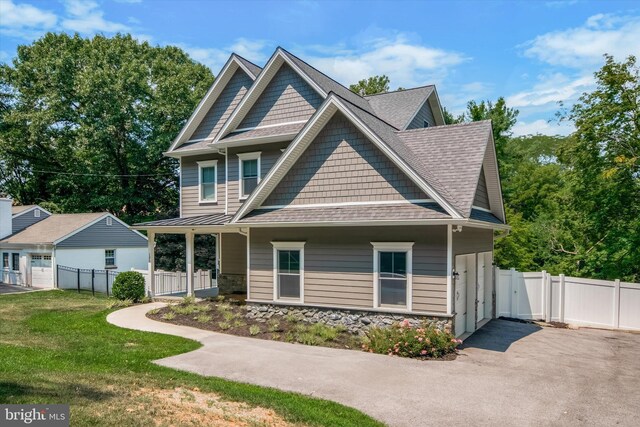 craftsman-style home with a front lawn