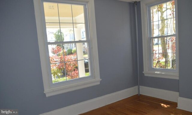 spare room featuring hardwood / wood-style floors