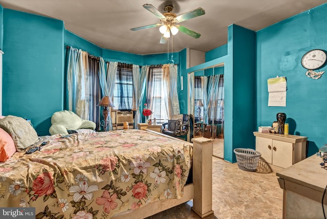 tiled bedroom with ceiling fan