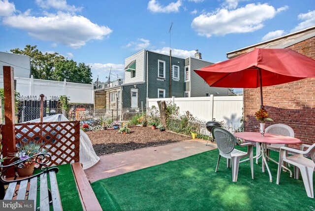 back of property with a patio area