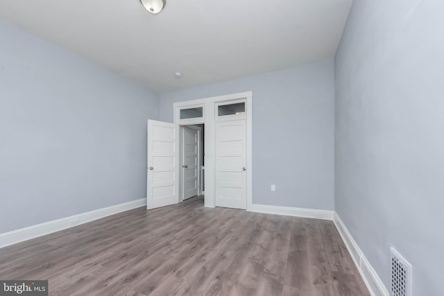 unfurnished bedroom with wood-type flooring