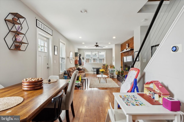 dining space featuring light hardwood / wood-style floors and ceiling fan