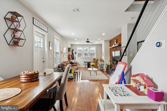 dining room featuring ceiling fan and light hardwood / wood-style flooring