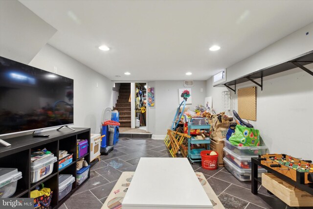 playroom featuring dark tile patterned flooring