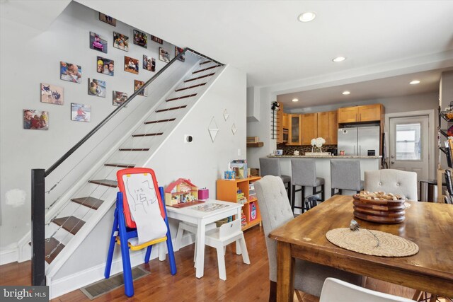 dining area with hardwood / wood-style flooring