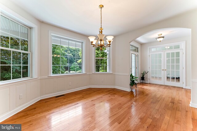 dining room with a notable chandelier and light hardwood / wood-style flooring