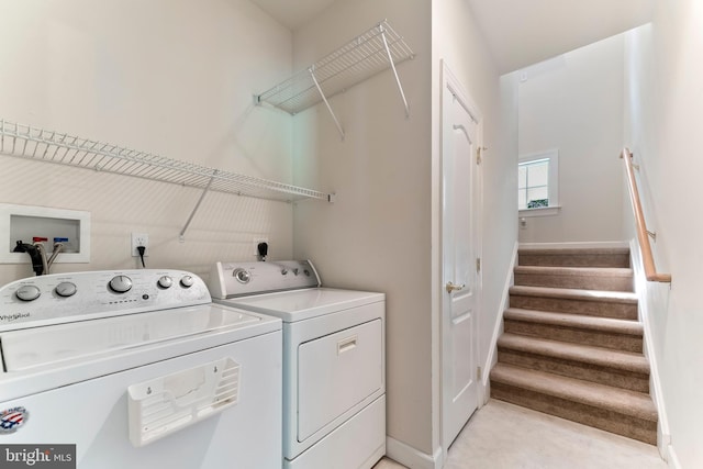 clothes washing area with independent washer and dryer