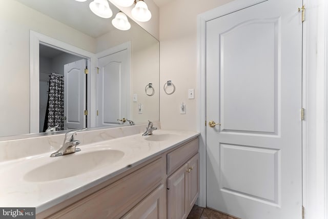 bathroom featuring double vanity and tile patterned flooring