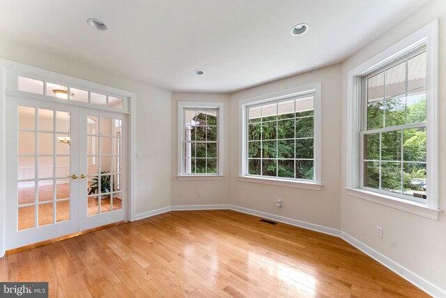 entrance foyer featuring light hardwood / wood-style flooring and french doors