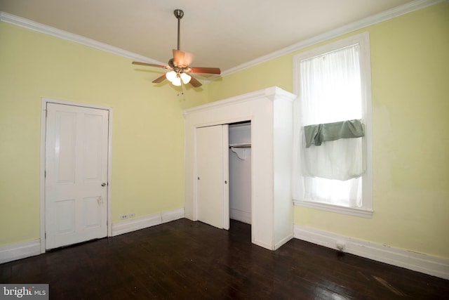 unfurnished bedroom featuring ceiling fan, dark hardwood / wood-style floors, and crown molding