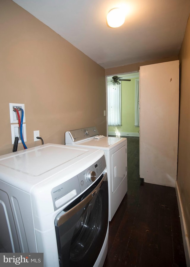 washroom with separate washer and dryer, ceiling fan, and dark wood-type flooring