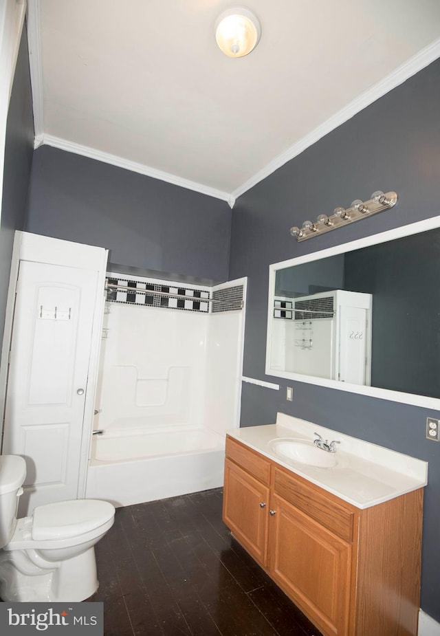 full bathroom featuring wood-type flooring, tub / shower combination, crown molding, vanity, and toilet