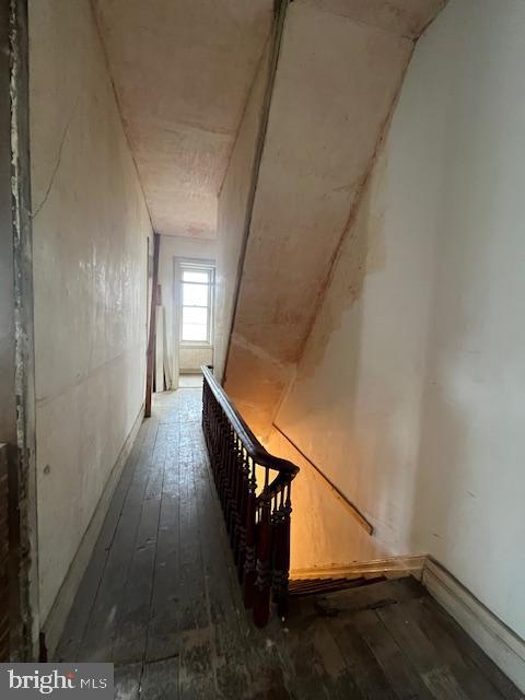 stairway with hardwood / wood-style flooring