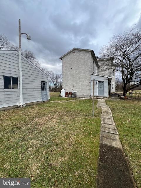 view of home's exterior featuring a lawn