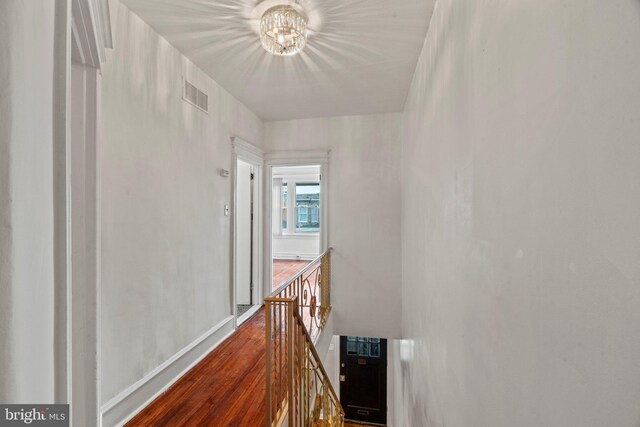 hall with dark hardwood / wood-style flooring