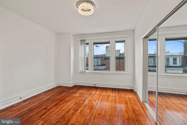 empty room with light hardwood / wood-style floors